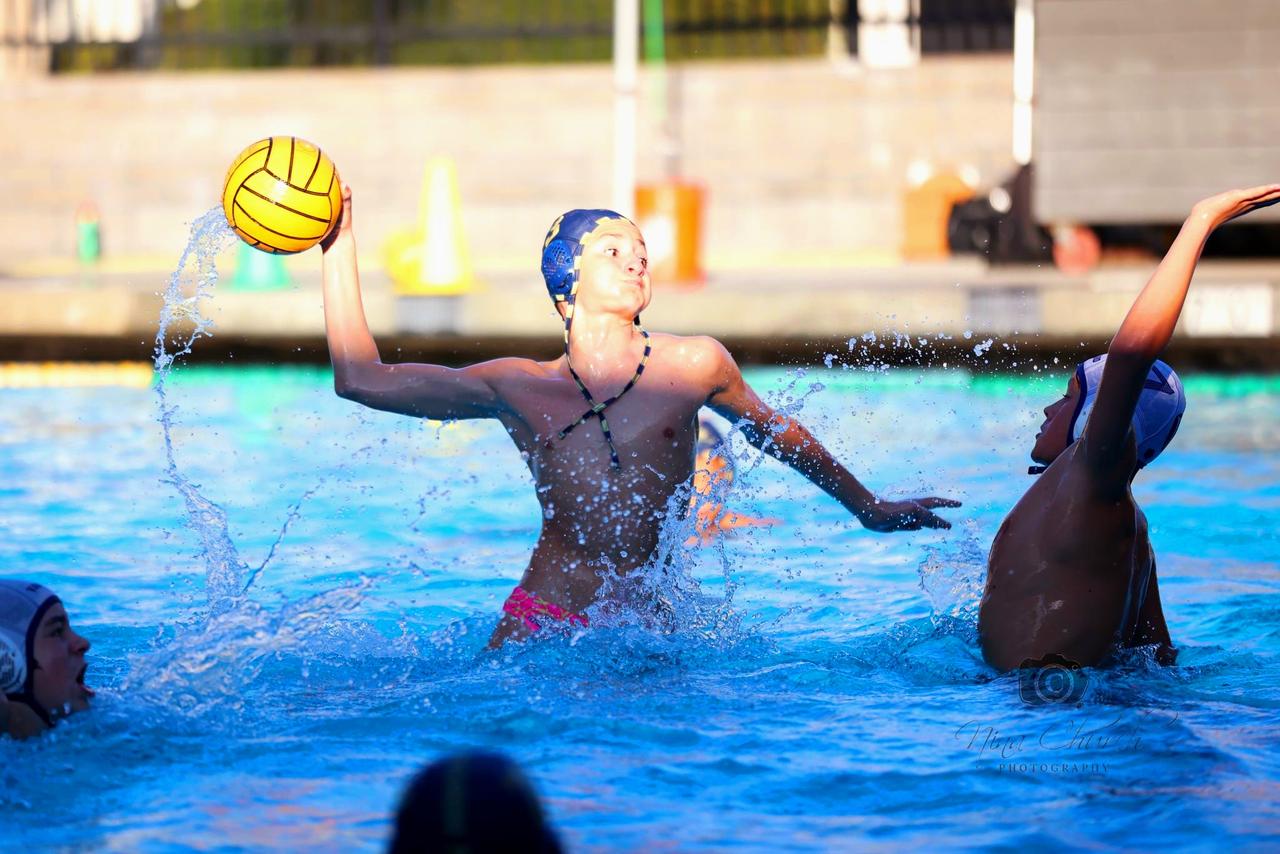 Simon competing in water polo